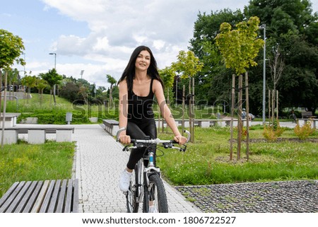 The girl rides a bicycle.