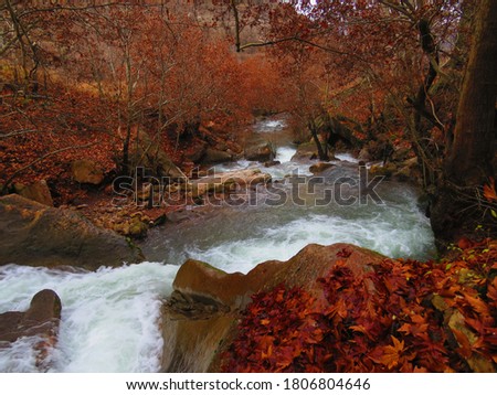 A wonderful picture of Waterfall in the river in Autumn
