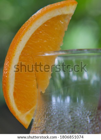 Orange fruit and glass of juice
