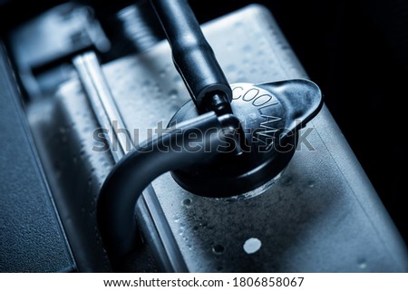 Car coolant water radiator bottle in the engine room. Car maintenance concept. Royalty-Free Stock Photo #1806858067