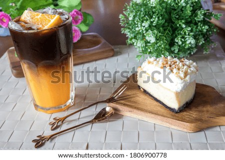 Delicious cake slice and Orange with coffee cocktail 