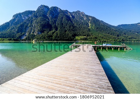 Bathing area with wooden construction at  Achen lake near Maurach, Austria. Royalty-Free Stock Photo #1806952021