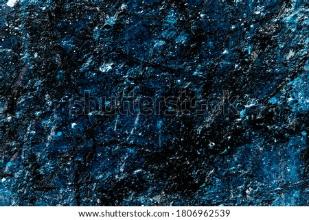 Texture of a iced blue, white, black wall in artistic style in purpose of a wallpaper or background