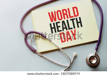 On a purple background a stethoscope with yellow list with text WORLD HEALTH DAY
