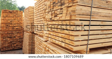 Stack Of Lumber. Sawmill, wood processing, timber drying Royalty-Free Stock Photo #1807109689