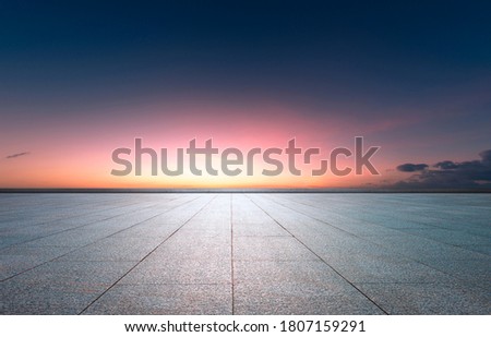  Evening glow, flat and wide asphalt road