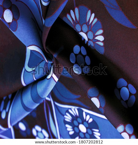 Texture, background, pattern, brown blue with a print of white flowers, geometric lines. Introduces a new, modern color palette, making it ideal to add sophistication to any design.