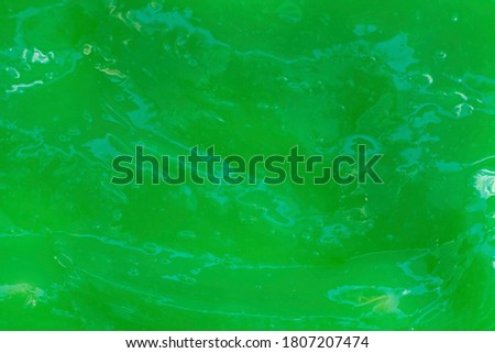 The texture of green slime. Design for halloween. Royalty-Free Stock Photo #1807207474