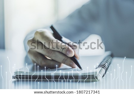 Creative concept of microscheme illustration and man hand writing in notebook on background. Big data and database concept. Multiexposure