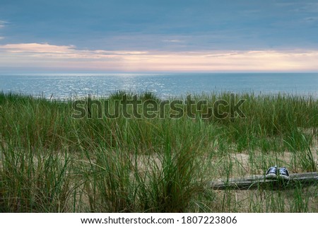 View to coast of Baltic sea and shoes.