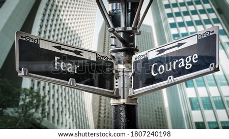 Street Sign the Direction Way to Courage versus Fear Royalty-Free Stock Photo #1807240198