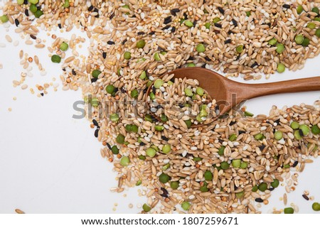 Miscellaneous grains with wood spoon Royalty-Free Stock Photo #1807259671