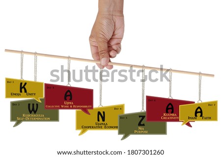 Kwanzaa Principles in Comment boxes hanging from wood stick