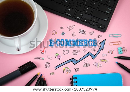 E-COMMERCE. Sales, service provision, training and development concept. Computer keyboard and coffee mug on the table