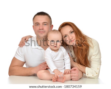 Young family mother and father with newborn child baby girl toddler isolated on a white background