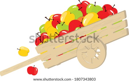 Apples in a wooden cart. Isolate on a white background. The concept of harvest. Fruit wheelbarrow full of yellow, green, red apples.