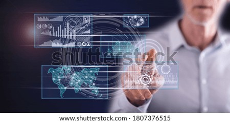 Man touching a business digital interface concept on a touch screen with his finger