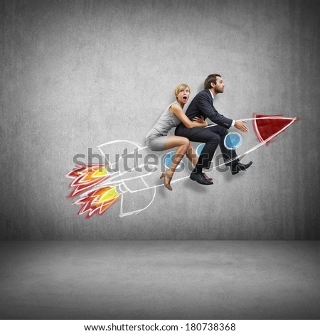 Businessman and young woman flying with rocket