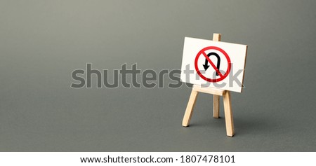 Easel with no turning back traffic sign. Assertiveness and striving, moving forward without retreating. Go to the goal, don't stop. Finish things. Not one step back Royalty-Free Stock Photo #1807478101