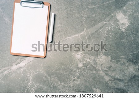 Feminine workspace with notebook, clipboard, paper on marble background with copy space. Top view, copy space. Blogger, feminine business concept. Flat lay. Birthday, Woman day. Mock up.