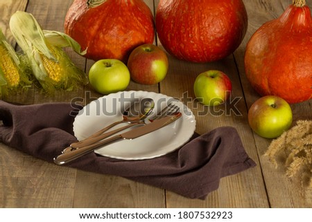 Thanksgiving Day. Thanksgiving Day Autumn background of pumpkins and leaves. thanksgiving. pumpkins, apples, corn. 