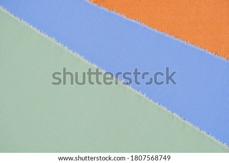 Green and blue sample on orange surface background