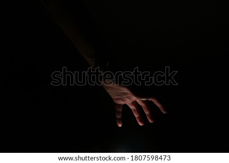 only hand with dark background