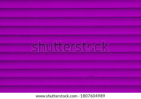 Background of the purple plastic siding. Plastic siding surface in purple tone. Abstract background and texture.