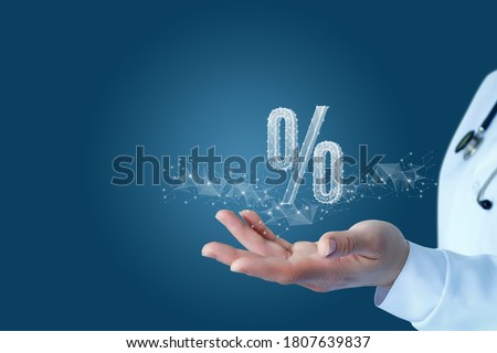 The concept of discount discounts in medicine. Doctor hand shows a hologram percent. Royalty-Free Stock Photo #1807639837