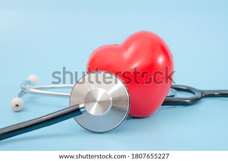 stethoscope and red heart. health care concept. Close-up.Blue background