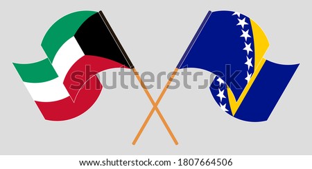 Crossed and waving flags of Kuwait and Bosnia and Herzegovina