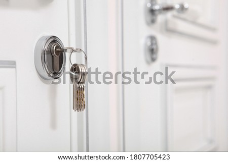 The key is in the lock. Concept of new housing or mortgage lending. Copy space.Horizontal photo. Royalty-Free Stock Photo #1807705423