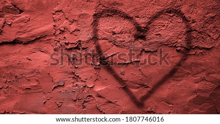 Red  Heart painting on pink concrete wall background. trendy street style. happy Valentines day.