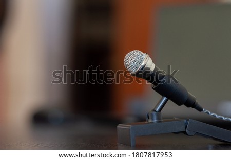 Microphone on a wooden desk ready to stream and share content