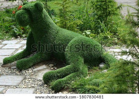   Green panther in the city square                             