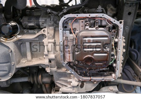 Automatic Transmission service in garage service shop. Royalty-Free Stock Photo #1807837057