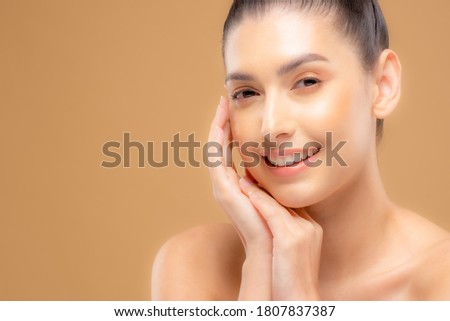 Beautiful woman with good skin taking pictures of face with hands, beautiful portrait and spa. Happy smiling face