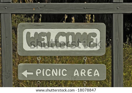 A wooden welcoming sign at picnic area in Fort de Soto park, Americas best beach, Florida