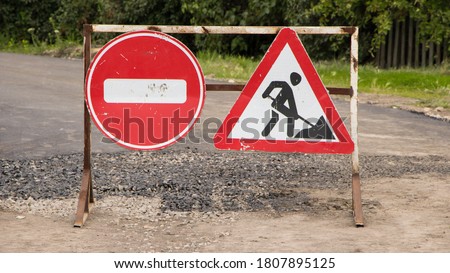 Road sign on the road. Work repair sign. Repair of roads. To make asphalt. Road Ahead Closed and Diversion signs in a street during construction work. No traffic sign.