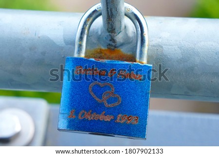 Blue love lock on a railing