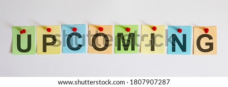 UPCOMING phrase is written on multi-colored stickers, on the white background. Business concept, strategy, plan, planning.
