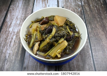 Chinese traditional boiled mix fresh organic vegetable in the bowl, White radish, Cantonese vegetable and cabbage. Famous menu in Chinese New Year and special ancient ceremony. Royalty-Free Stock Photo #1807942816