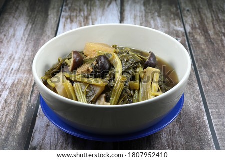 Chinese traditional boiled mix fresh organic vegetable in the bowl, White radish, Cantonese vegetable and cabbage. Famous menu in Chinese New Year and special ancient ceremony. Royalty-Free Stock Photo #1807952410