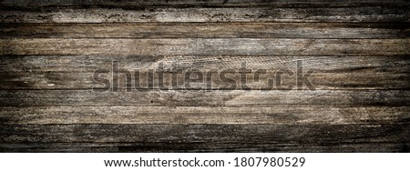 panoramic grey grunge background of old wooden boards with vignette