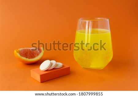 Vitamin C effervescent tablet, water soluble with orange flavor Royalty-Free Stock Photo #1807999855