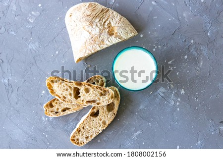 Bread and milk in blue glass. top view. 