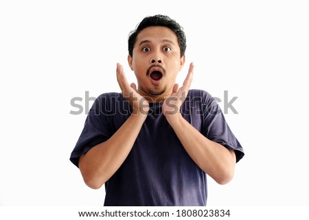 shocked man with both hand under the chin