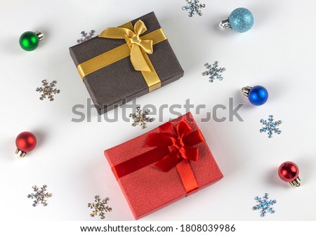 Flatley Christmas. Festive Christmas background. Two gifts and decorative balloons on a white background. Copyspace