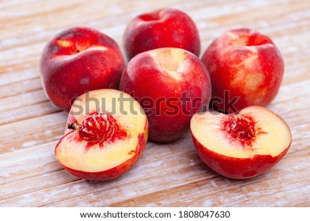 Fresh juicy peaches on wooden background, harvest season