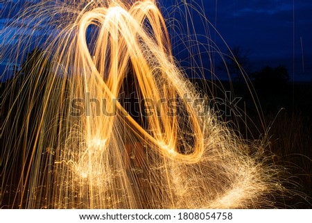 Fire in a photo. Photo taken on a summer evening, thanks to a lightpainting